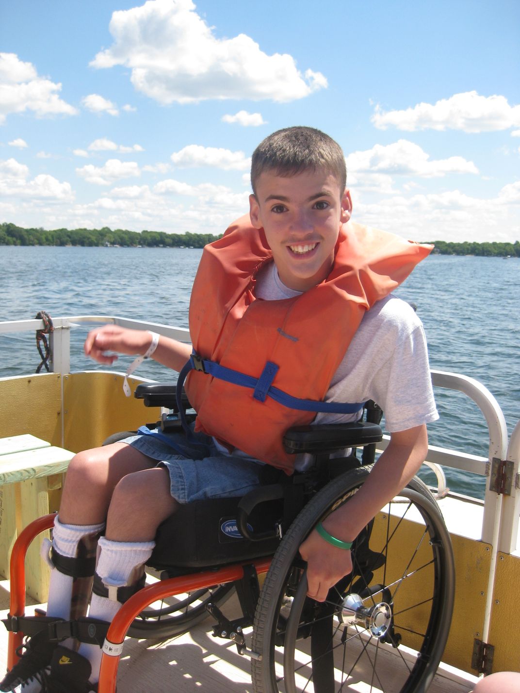 Boy in wheelchair on a boat ride in Northern Minnesota Smithsonian