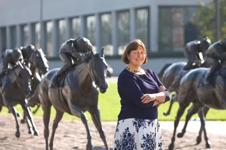 "Horses define Lexington in many ways," says Edwards (with Thoroughbred Park's statues).