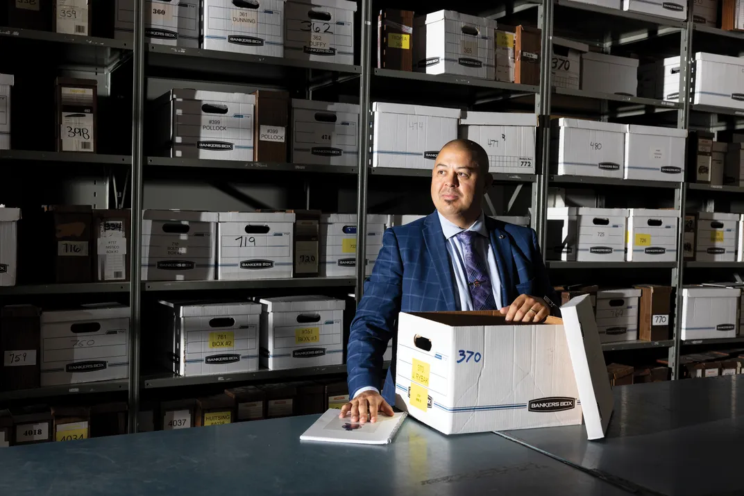 Jason Rybak leafs through old case files at the Thunder Bay Police Service. He began investigating the Morrisseau frauds in 2019 after watching There Are No Fakes.
