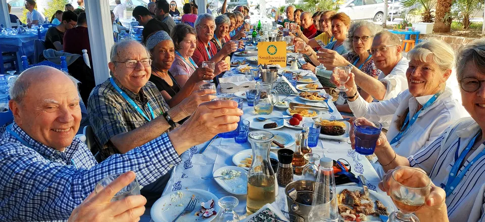 None Smithsonian Journeys Travelers enjoying a meal in Greece on our Athens and Poros Tour. 