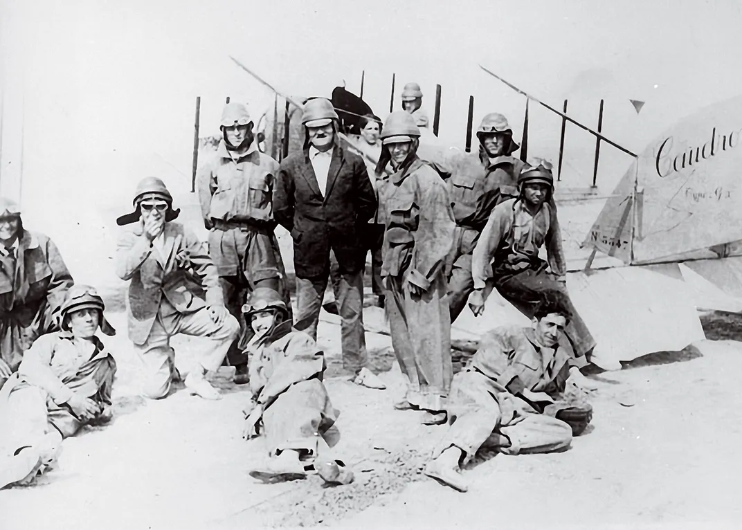 a black and white photo a flight crew sit for a portait