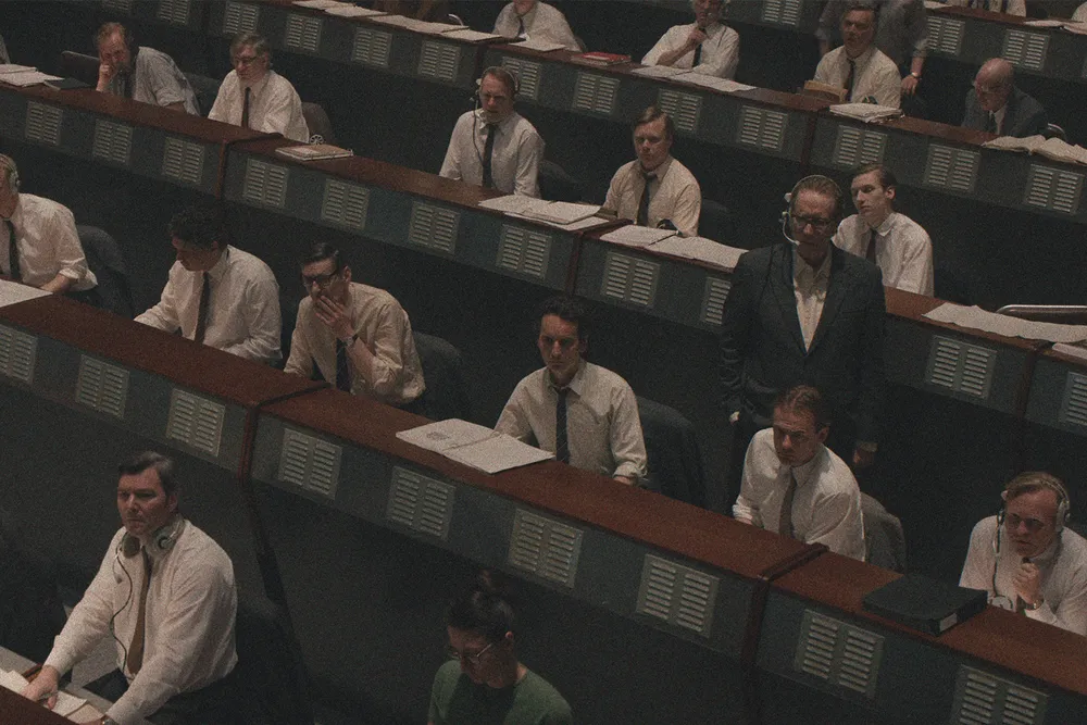 Rhys Ifans (standing in second row) as the chief designer in "Star City"