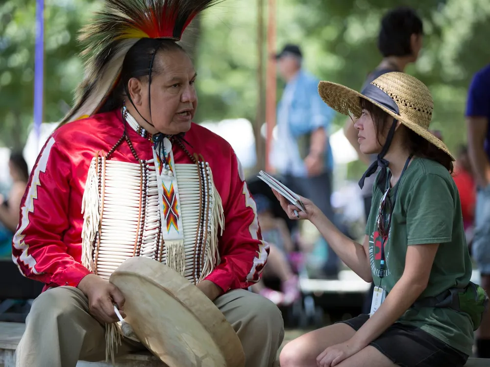 Elisa Hough interviews Dennis Zotigh (Kiowa/San Juan Pueblo/Santee Dakota), a cultural specialist at the National Museum of the American Indian. (Daniel Martinez, Center for Folklife and Cultural Heritage, Ralph Rinzler Folklife Archives.)