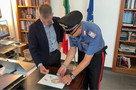 Italian officials with the five stones and brick fragment