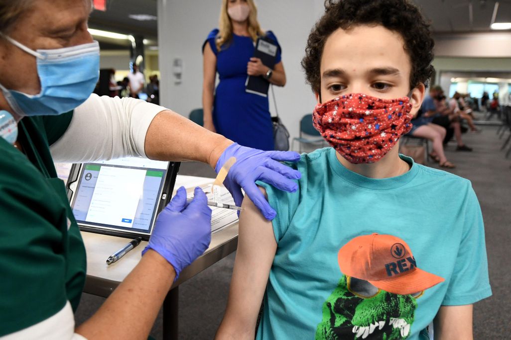 A nurse gives a 16-year-old a shot of the vaccine at a clinic in Florida.