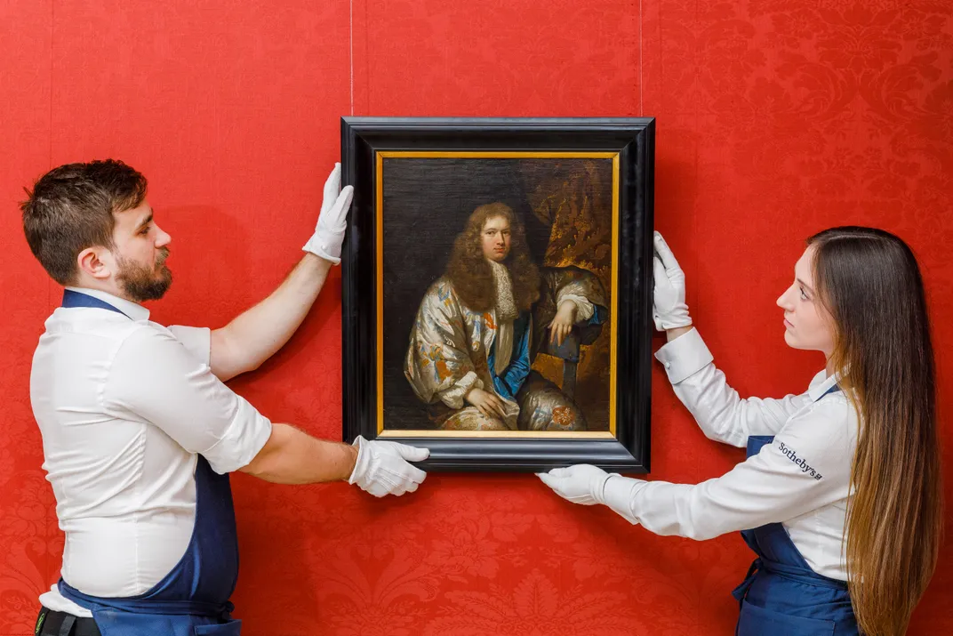 Two people holding Caspar Netscher's Portrait of Steven Wolters