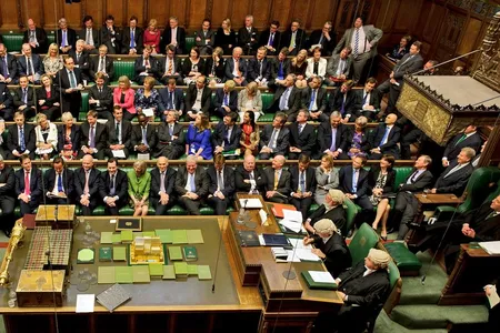 Clerks (right) will no longer have to wear their distinctive wigs in the House of Commons.