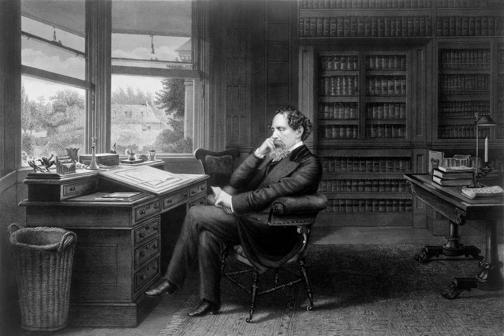Charles Dickens in his study