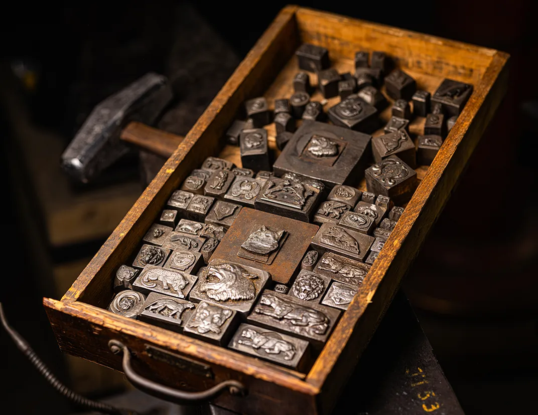 a drawer contains hubs depicting various cats and dogs.