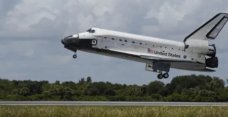 Endeavour returns to Earth after 12 days in space.