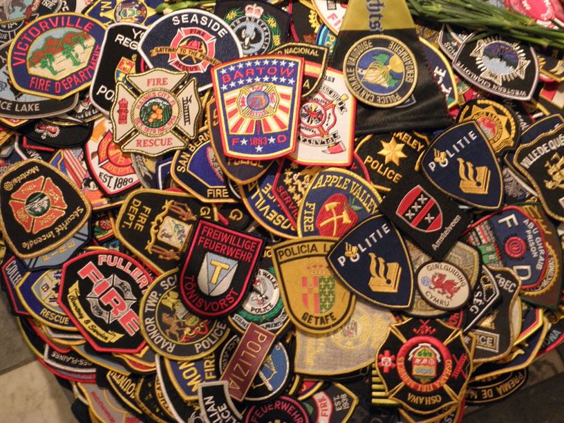 Badges of first responders from around the world in tribute to the ...