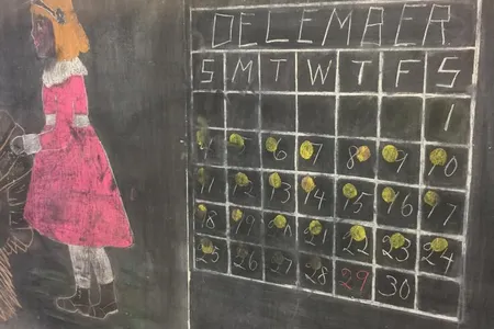 One of the chalkboards shows a calendar in the process of switching from November 1917 to December — only the month label and the first day apply to the new month.