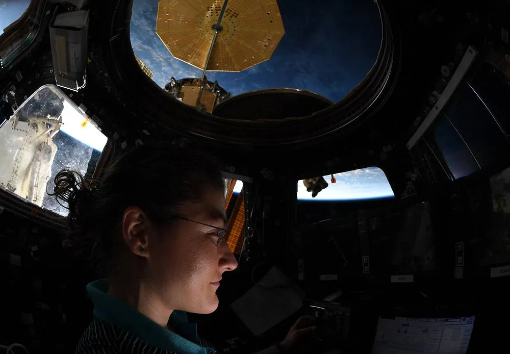 Koch makes observations from the International space Station's cupola