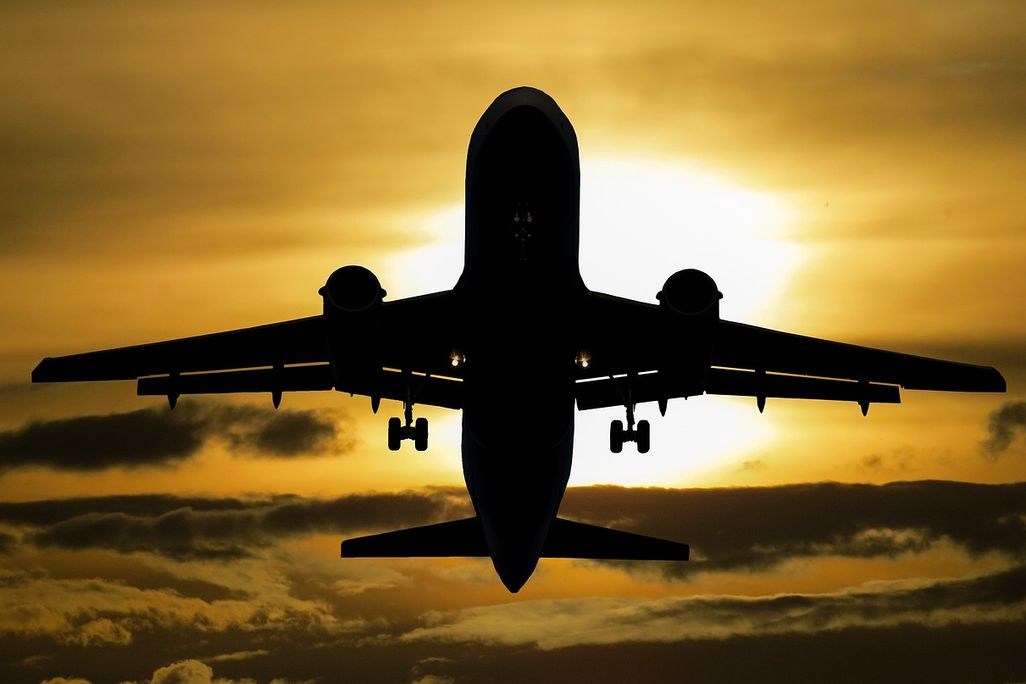 Plane silhouette against the sun