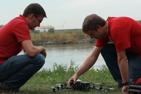 University of Nebraska-Lincoln researchers Matt Waite (left) and Carrick Detweiler use a Falcon 8 UAV to document the effects of drought on the Platte River.