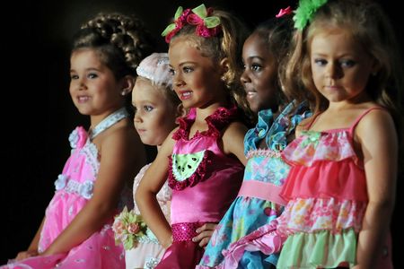 The top five contestants in the 4–6-year-old section wait on the judges' final decisions during the Little Miss Perfect competition at Renaissance Montgomery Hotel and Spa at the Convention Center in Montgomery, Alabama.