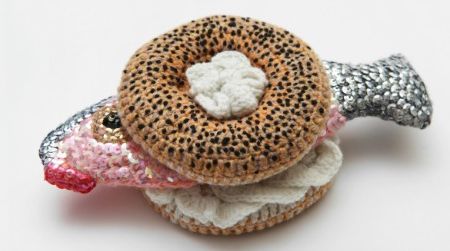 Designer Kate Jenkins goes for a mix of realism and humor in her crocheted works of art. Here, the poppy seed bagel looks quite delectable until you notice the lips on that lox.