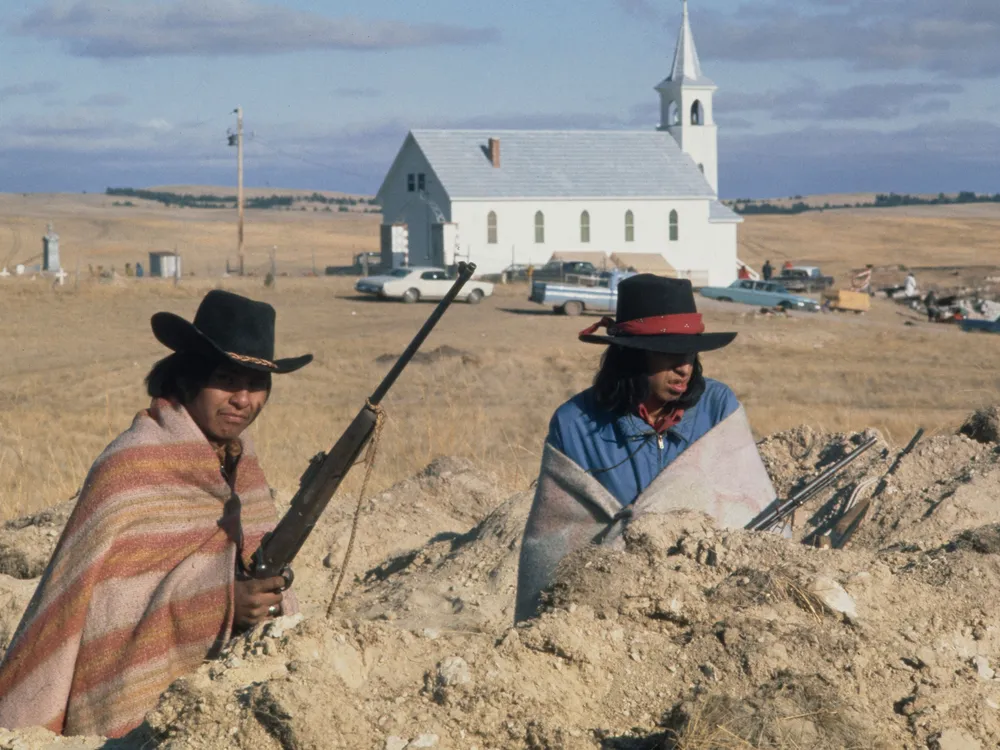 Two Natives waiting for the fire fight