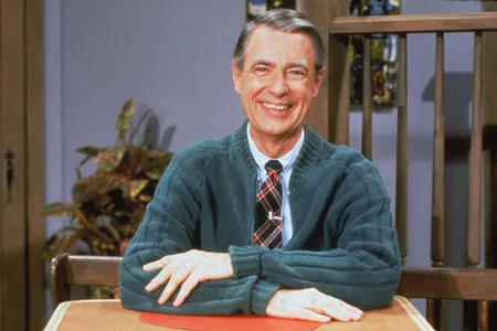 Fred Rogers, wearing his usual uniform of a cardigan and a tie, in the 1980s.