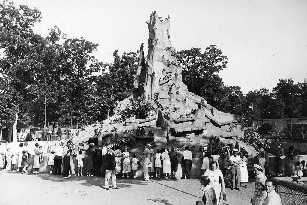 Visitors gather at the foot of Monkey Mountain, an attraction at Frank Buck's Jungle Camp in Massapequa, New York.