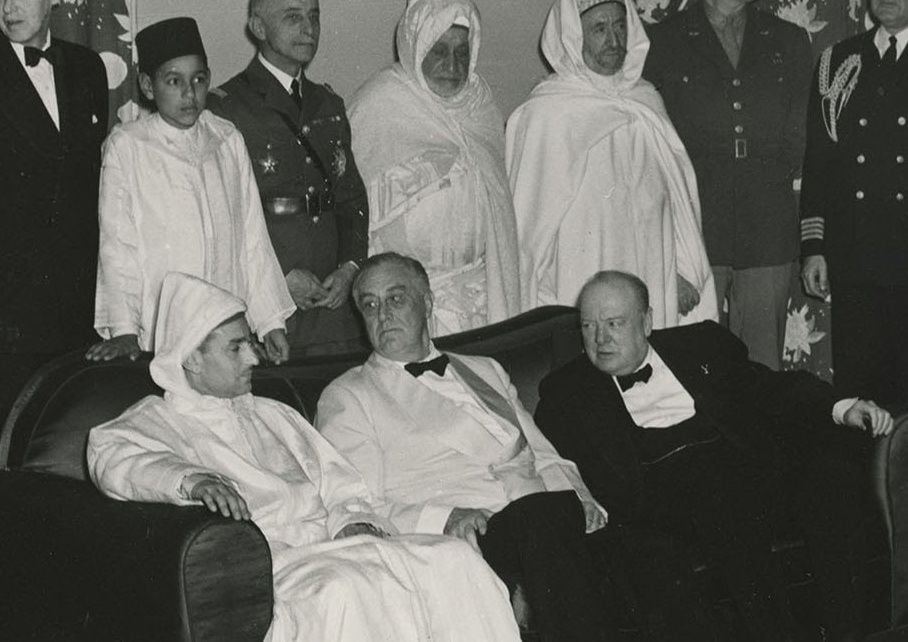 Mohammed, Franklin D. Roosevelt and Winston Churchill at the 1943 Casablanca Conference. Prince Hassan is shown standing behind his father.