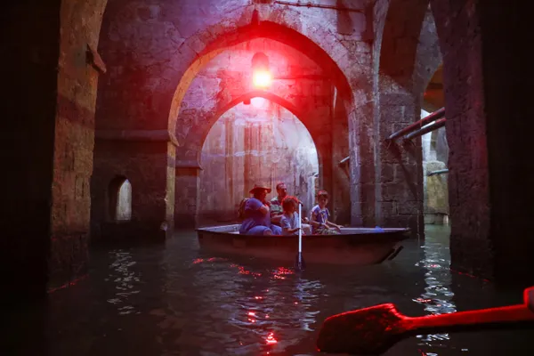 People are rowing a boat in the Arches Pool in Ramla thumbnail