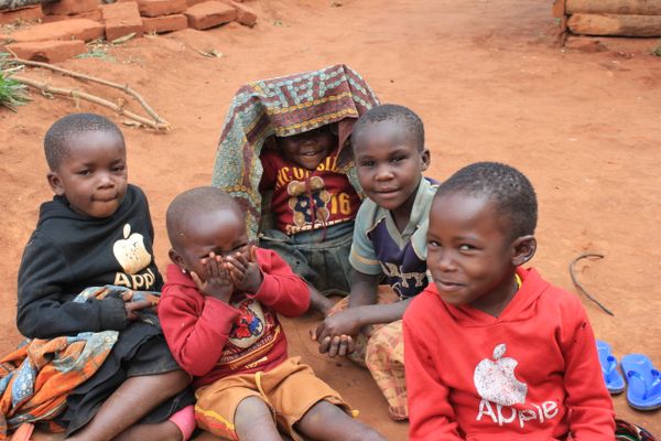 Young children playing peek-a-boo in the Ipalamwa area of Tanzania thumbnail