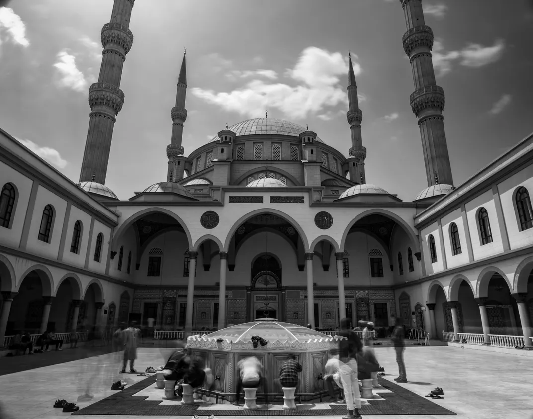 4 - Worshipers wash themselves before noon prayer at the Nizamiye Mosque, opened in 2012.