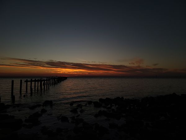 The sun rising on Mobile bay thumbnail