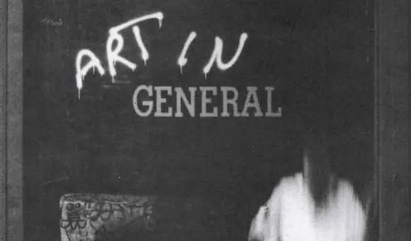 Detail of poster with grayscale image of storefront and blurry figures
