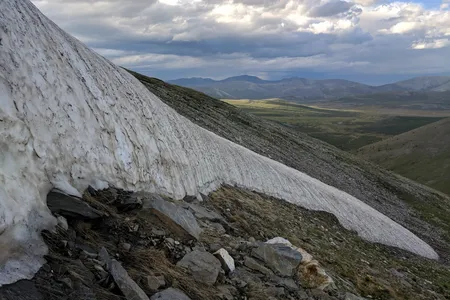 An ice patch nearing complete melt in northern Mongolia's Ulaan Taiga Special Protected Area, 2018.

