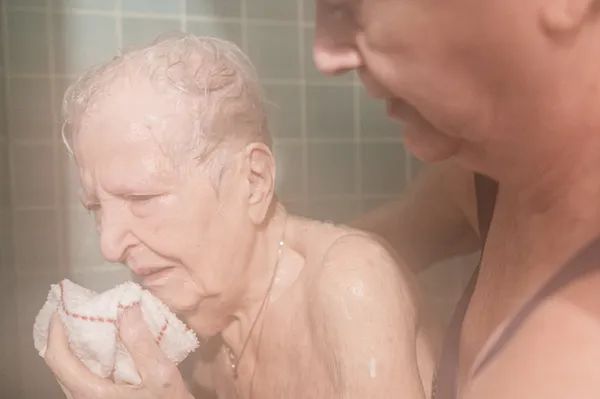 Barbara has a weekly shower in her home with the assistance of her youngest daughter, Libby. thumbnail