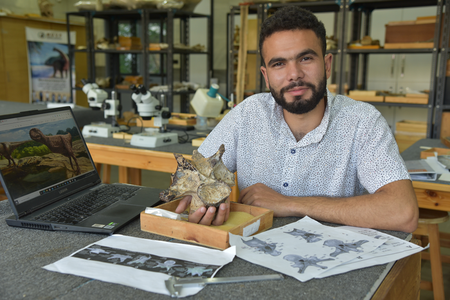 Despite only uncovering one bone, researchers were able to identify it as an abelisaurid by the distinct structures that stuck out on the top left and top right of the neck vertebrae called epipophyses. (Pictured: Graduate student, Belal Salem holding the neck vertebra of the unamed abelisaurid theropod found in the Bahariya Oasis)