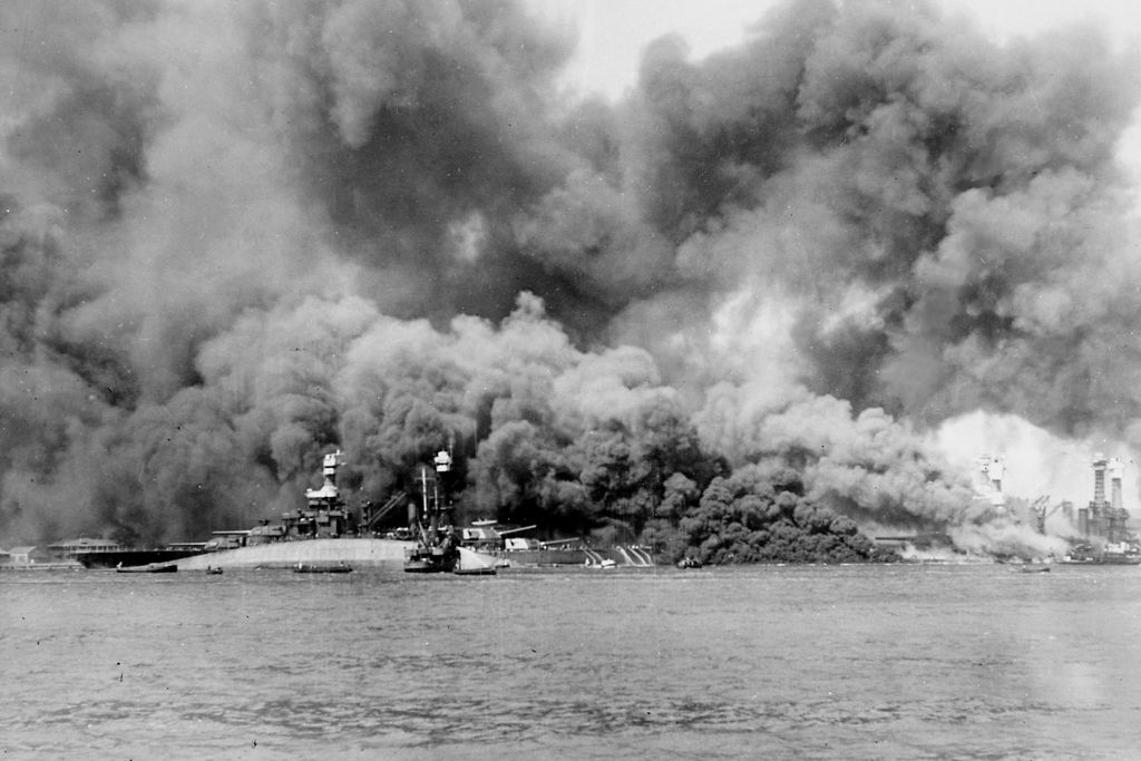USS Oklahoma in flames during the attack on Pearl Harbor