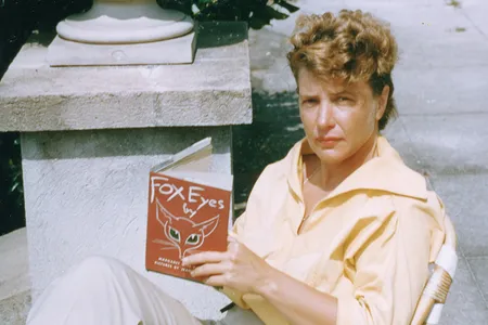 Margaret at Stafford House on Cumberland Island, holding her first copy of Fox Eyes, illustrated by Jean Charlot. This story was inspired by her time on Cumberland as a teenager.