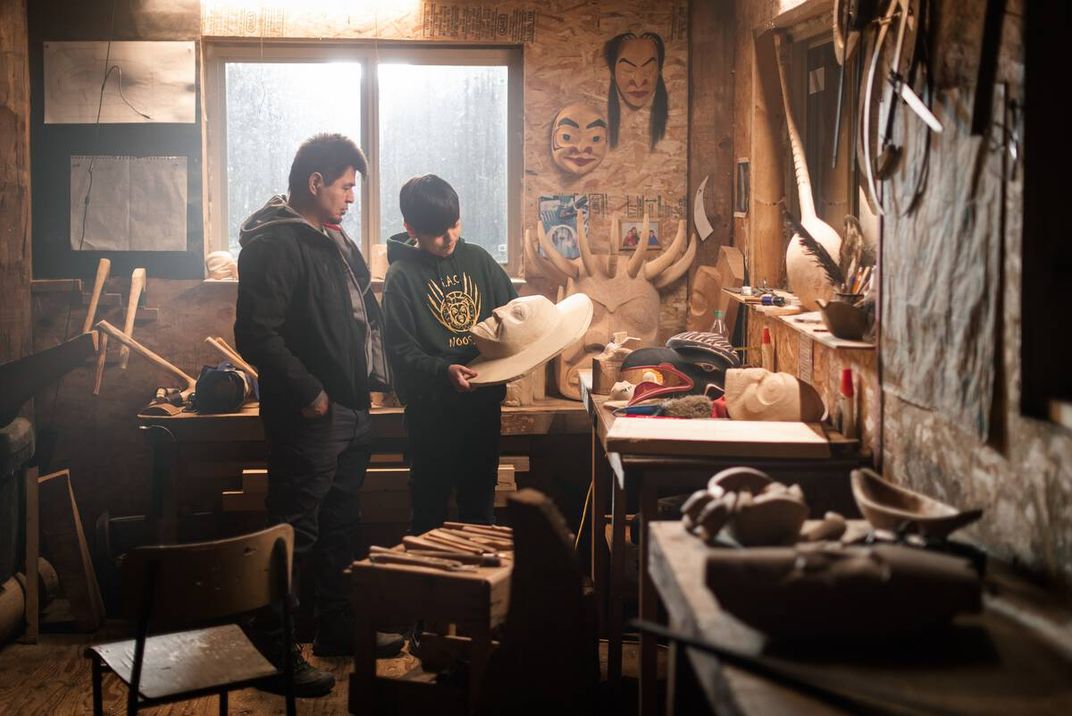 Nisga'a carver Calvin McNeil with his son, Jacob, in the Laxgalts'ap Carving Shed