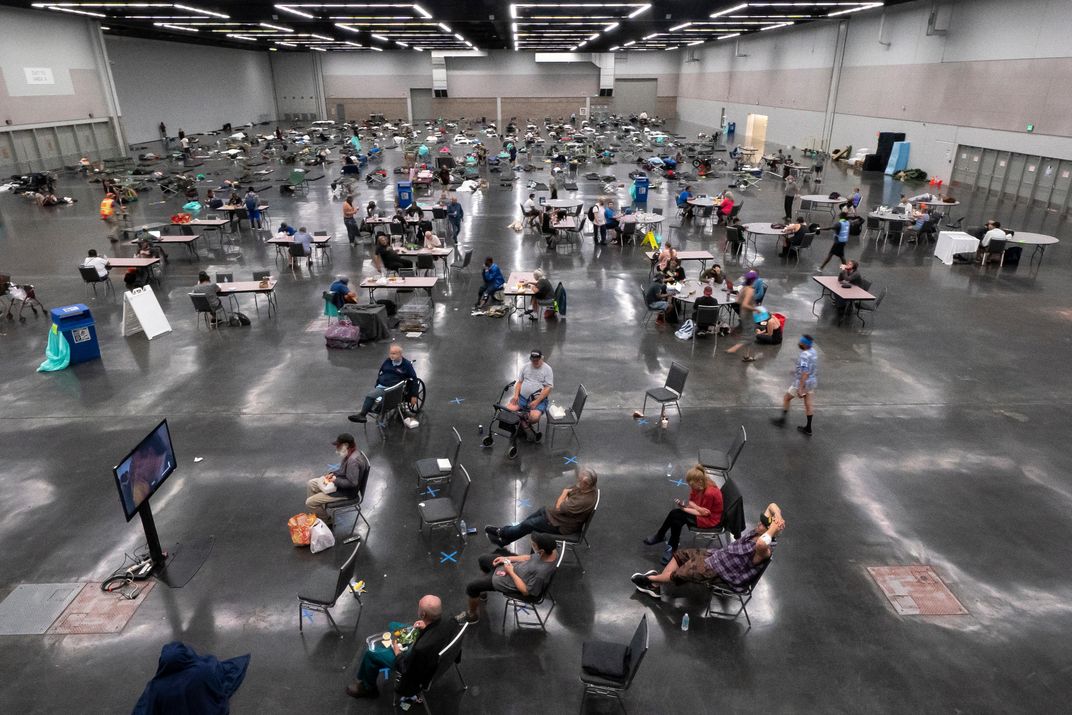 Portland residents fill a cooling center with a capacity of about 300 people at the Oregon Convention Center June 27, 2021 in Portland, Oregon. 