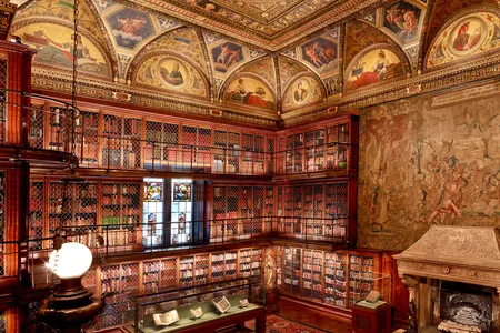 With its exquisitely vaulted ceiling and inlaid walnut bookshelves covering three floors, the East Room was designed as a treasury and showroom for Morgan&#39;s rare book collection.