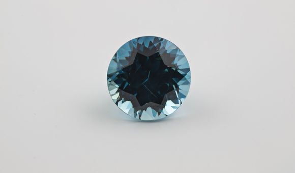 Zircons are the oldest minerals in the world and come in colors like the rich blue above. Researchers have now used these gemstones to identify when modern plate tectonics began. (Ken Larsen)