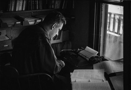Mack McCormick writing at his typewriter.