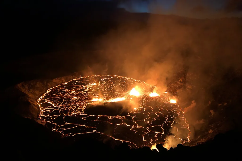 An image of the glowing red fissures inside of the Halema'uma'u Crater located on the Kīlauea volcano's summit
