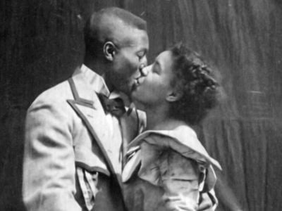 Saint Suttle and Gertie Brown embrace in the 1898 film 'Something Good-Negro Kiss.'