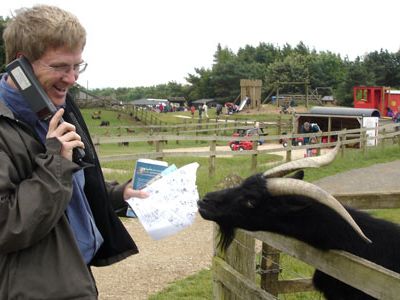 A hungry goat eats Rick Steves' map at the Cotswold Farm Park.