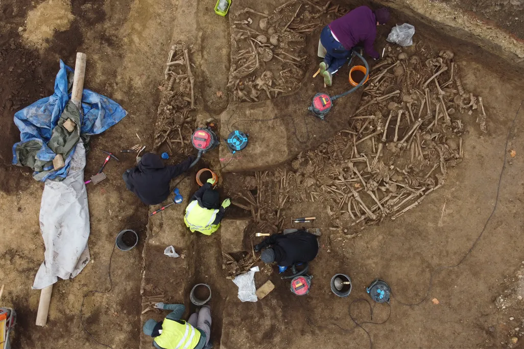 An aerial view of the mass grave, which was found beneath a soccer field in Vienna in October 2024