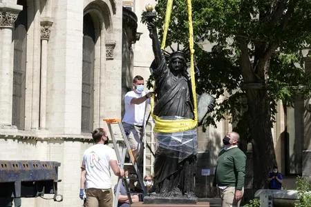 Workers removed the replica Lady Liberty from its plinth on June 7. The statue will set sail for the U.S. on June 19.