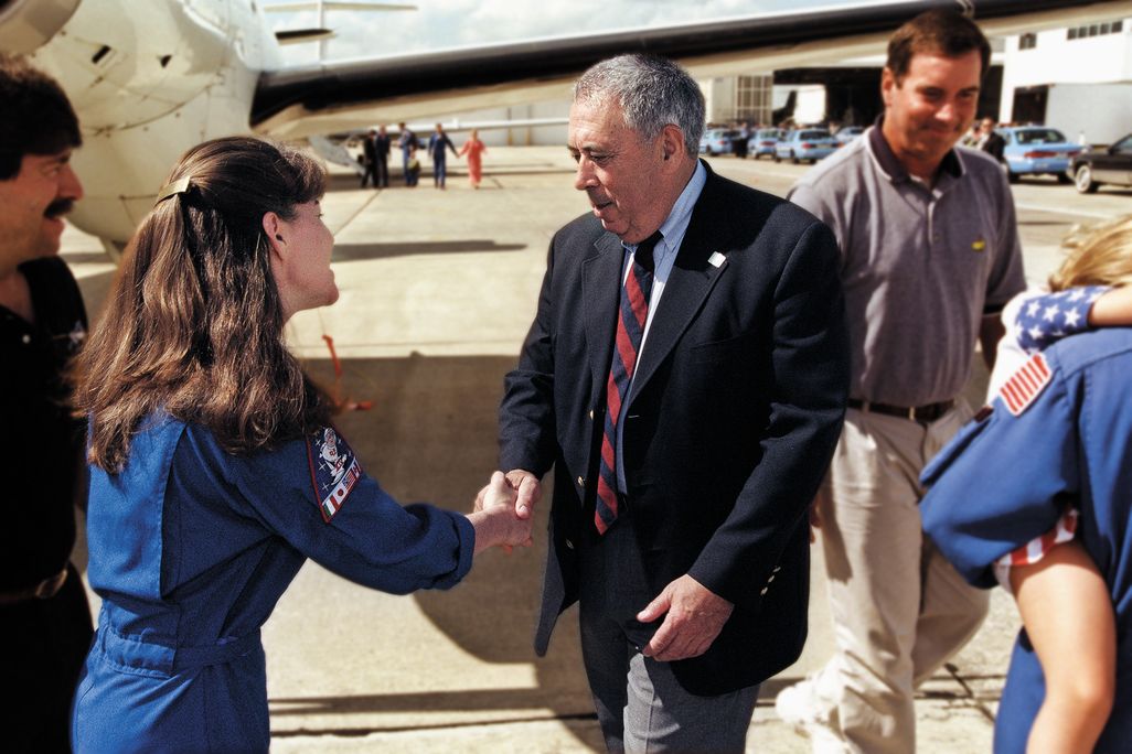 George Abbey rode with the astronauts to the launch pad before every shuttle launch, and was there to greet them when they returned (here with STS-93's Cady Coleman).