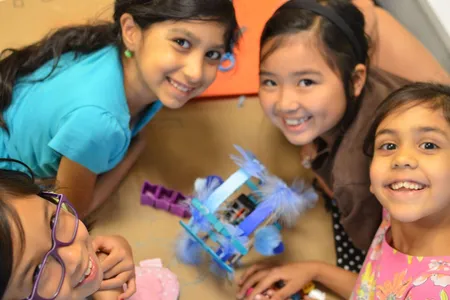 Girls get taught simple circuits, but how they decorate their robots is up to them.