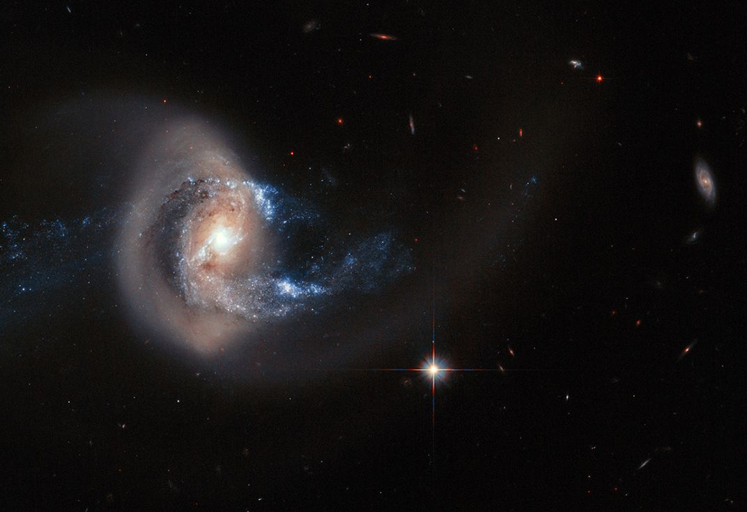 Cosmic Jaw-Droppers Include a Twisted Galaxy and an Aurora Rocket Volley