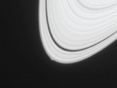 The bright spot on the lower left of Saturn's A ring is not Peggy, but rather the visible sign of Peggy's gravitation distortion of the ring structure.
