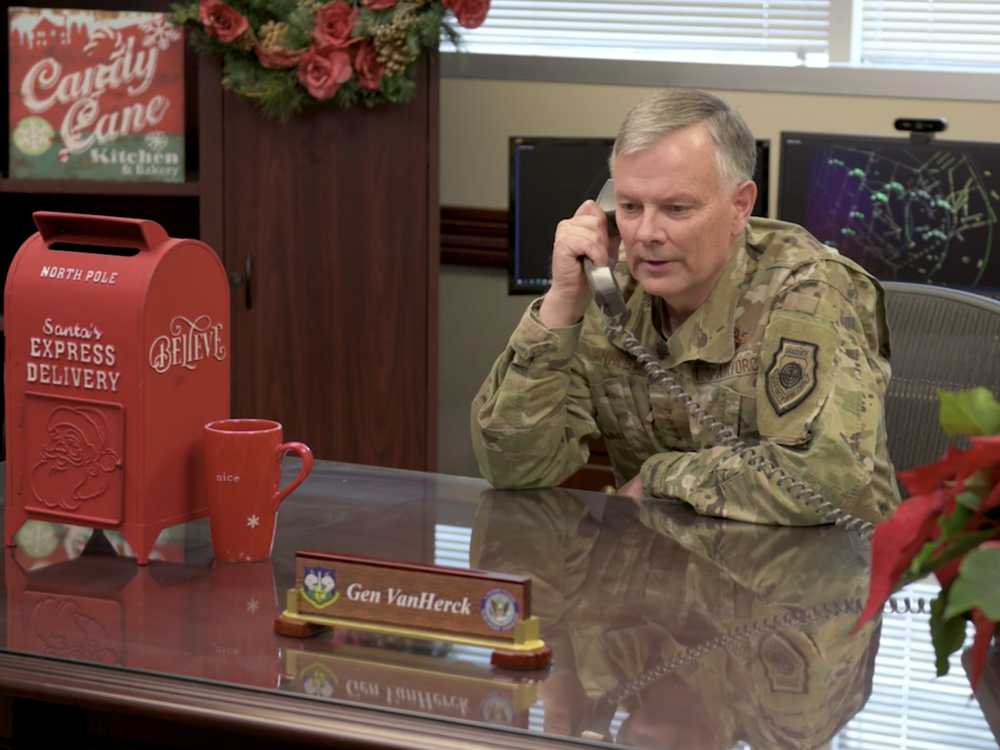 Gen. Glen VanHerck, Commander of North American Aerospace Defense Command and U.S. Northern Command talks on the phone as part of a video celebrating the NORAD Santa Tracker's 65th year.